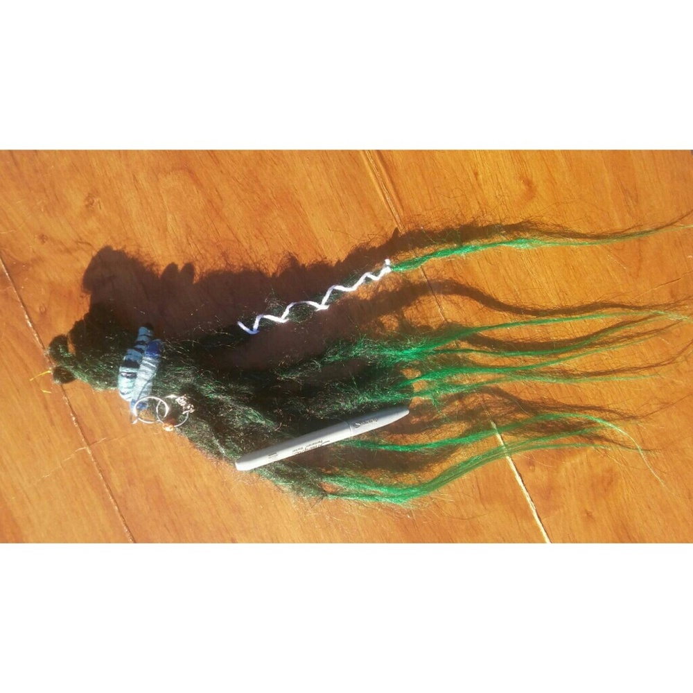 Knotty black green ombre dreadlocks with dread tie